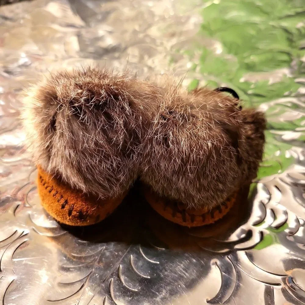 Moccasins,  real leather and real rabbit fur,  has a great insole! Size 8 child